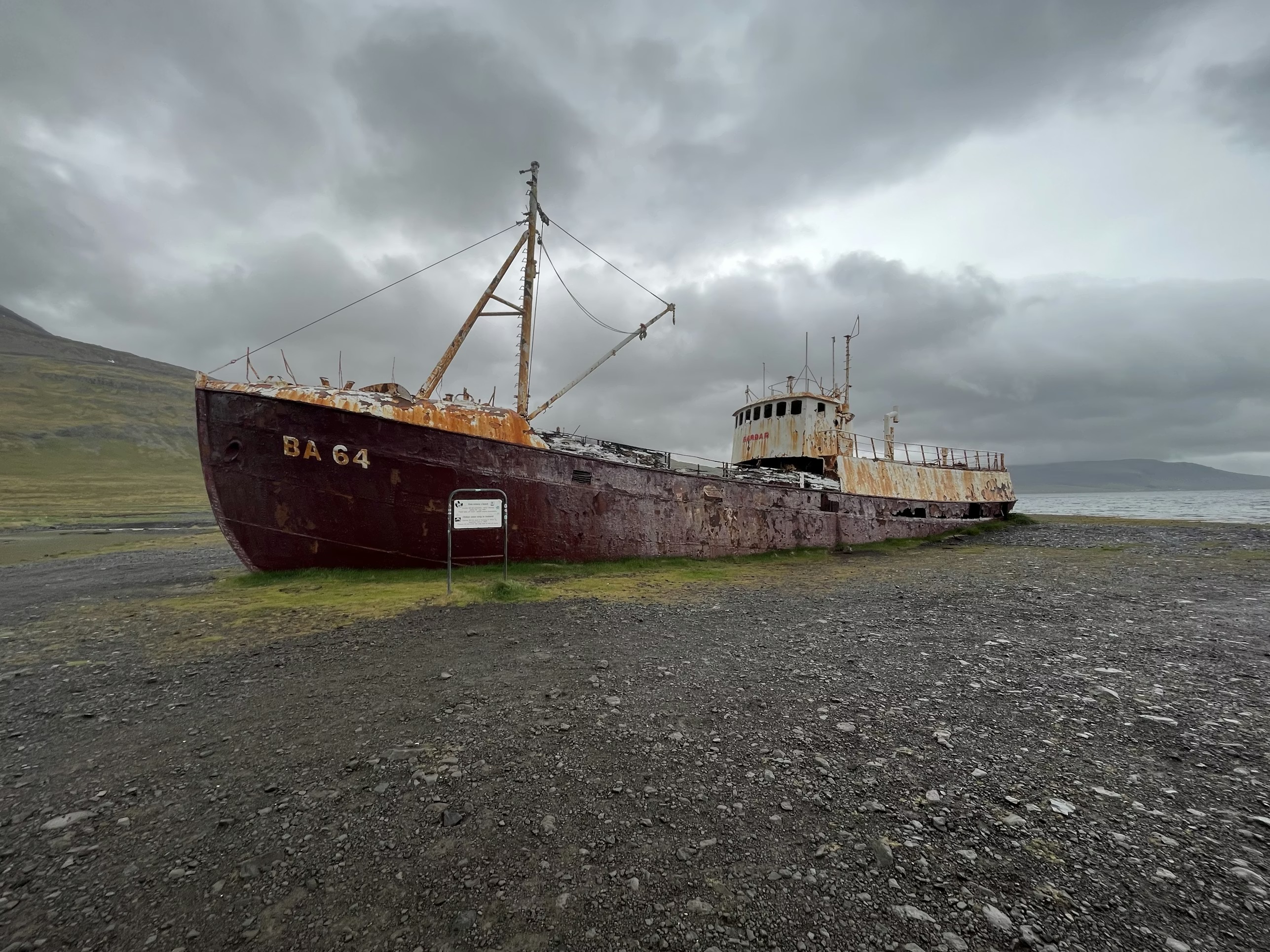 A weathered ship shown before and after applying a Fujifilm-style film simulation in Fujilab.
